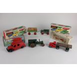 Four Tri-ang Minic clockwork model motor vehicles, comprising a fire engine and a mechanical horse