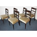 A set of six Edwardian inlaid dining chairs with scroll decorated bar and pierced oval panel