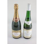 A bottle of J. de Telmont Grande Reserve Brut Champagne, 750 ml., 12% vol., together with a bottle