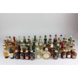 A collection of miniature bottles of whisky, to include Maker's Mark, Booker's, The Knockdhu 12