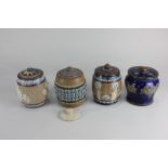 Four Royal Doulton tobacco jars including one by Lizzie Axford, and one by August M Birnie (a/f)