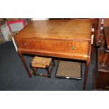 An oak dressing table / chest on stand, with rectangular top and long drawer with flower embossed