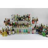 A collection of miniature bottles of liqueurs and spirits, to include rum, port, sherry and