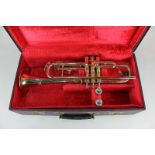 A brass trumpet marked Zenith MKII J R Lafleur London Foreign 527591, with two mouth pieces, in