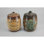 A Victorian Doulton Lambeth tobacco jar and cover by Rosina Harris, depicting three panels of