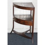 A George III mahogany corner washstand with later top, central drawer, on splayed supports