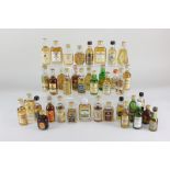 A collection of miniature bottles of whisky, to include The Glenlivet, Campbell Town Loch and