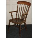A farmhouse kitchen chair, with spindle back, on turned supports and legs
