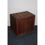 A carved oak storage box, with internal divider, on castors, 46cm wide