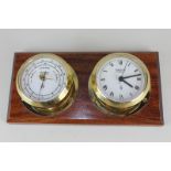 A Wempe brass cased porthole clock and barometer, on hardwood mount, both marked Chronometerwerke