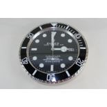 A Rolex advertising wall clock marked Oyster Perpetual Date Submariner, with date aperture, 34cm