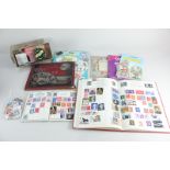 A collection of 20th century British and World stamps within four albums and loose, with a small