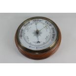 An oak cased aneroid wall barometer, the circular dial marked Mappin & Webb Ltd Oxford Street, 25cm