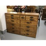Early 20th cent. Pitched pine printers desk with thirteen drawers of various depth & fittings.