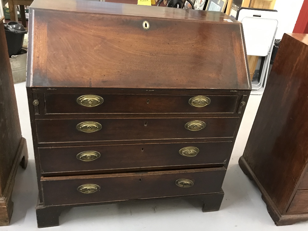 Georgian mahogany bureau, drop flap with fully fitted interior. Graduated four drawers with brass