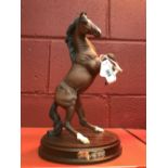 20th cent. Ceramics: Royal Doulton, handmade sculpture of rearing stallion on treen base "Spirit