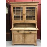 Late 19th early 20th cent. pine kitchen dresser with brush slides, two drawers over a twin door