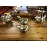 20th cent. Platedware: Tea set comprised of hot water pot, teapot, sugar bowl, and a milk jug (4).