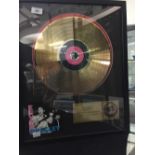 Rock 'N' Roll: Elvis Presley limited edition collectors series Gold style disc. Framed and glazed.