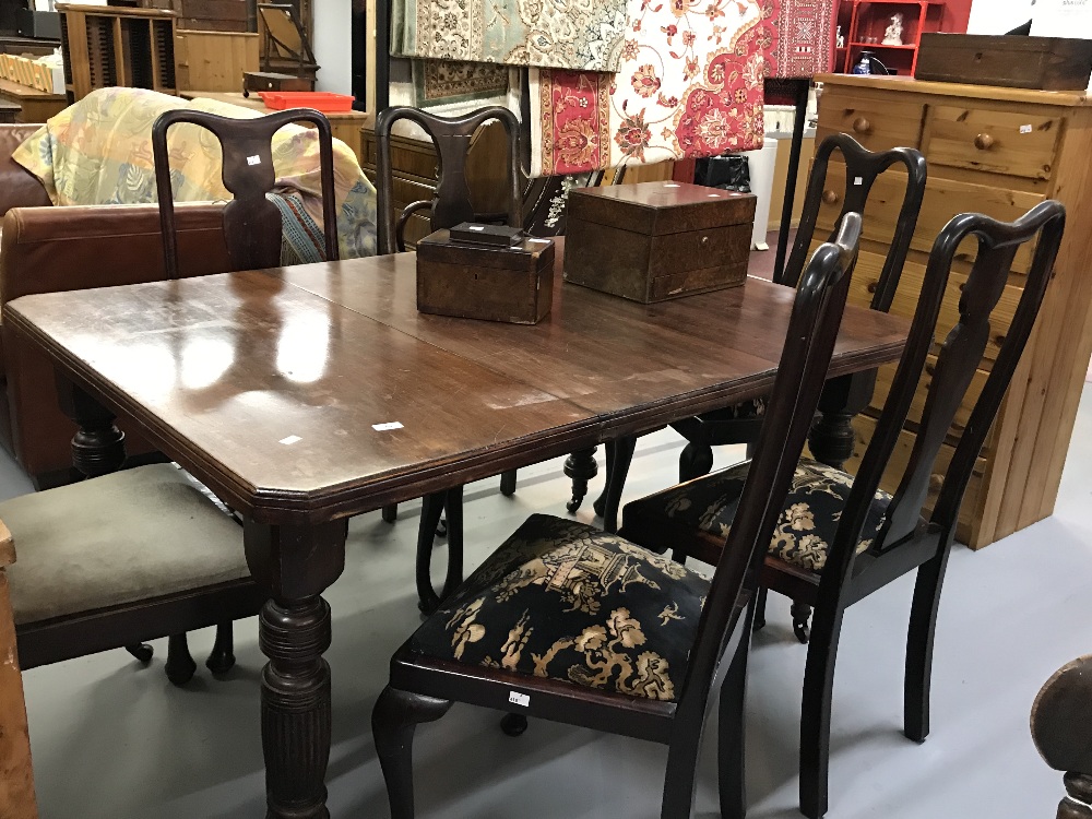 19th cent. Mahogany extending dining table with one leaf with turned & reeded supports on castors.