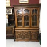 20th cent. Beech glazed bookcase two shelves. The cupboards beneath have two doors and one shelf