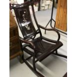20th cent. Hardwood rocking chair with mother of pearl inlay.
