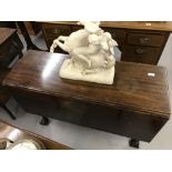 Early 19th cent. mahogany drop leaf table on turned supports rising off ball and claw feet.