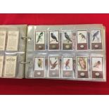 Cigarette Cards: Early 20th cent. album containing 19 sets of cards issued by Godfrey Phillips Ltd