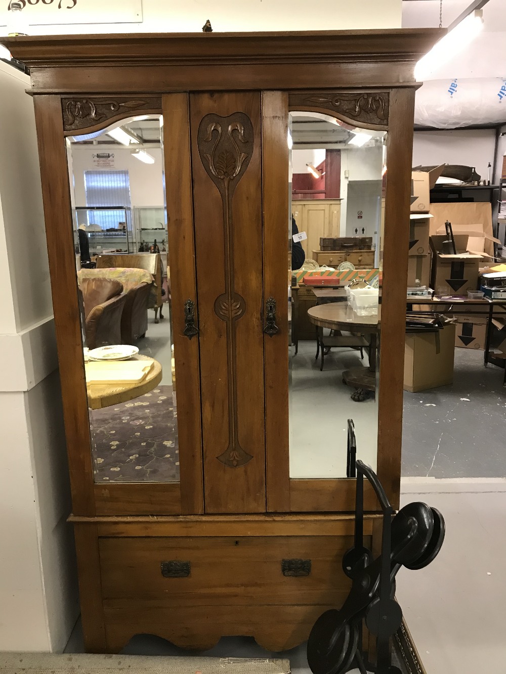 20th cent. Satinwood wardrobe with art nouveau carved motifs, two hanging sections with hooks over
