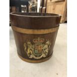 20th cent. Coopered oak planter/bucket, two brass handles with Royal Coat of Arms to the front.