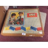 Toys: Lego System (1959), in treen box. Two build bases, Lego blocks, wheels, flags, trees, signs,