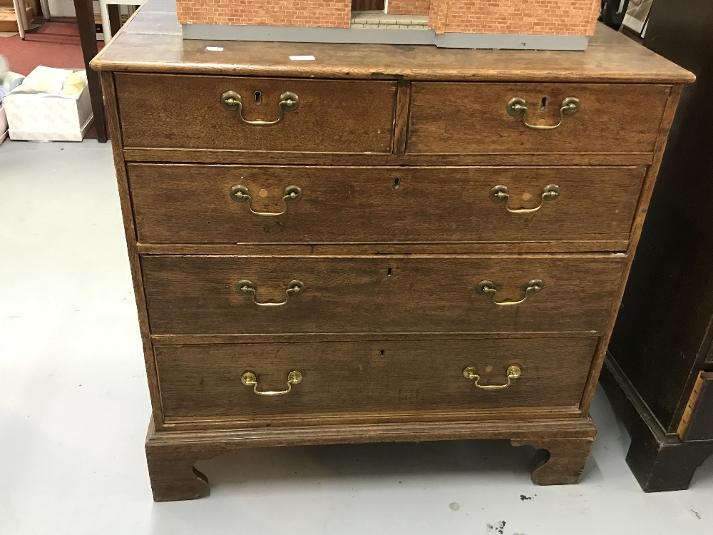 19th cent. Oak chest of drawers of two short drawers over three drawers. The whole on bracket