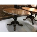 19th cent. Rosewood, oval loo tilt top table, single turned column on four splayed supports.