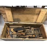 20th cent. Oak carpenter's chest containing treen hand tools including brass level, scribes, planes,