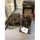 Cameras: No 12 watch pocket Carbine camera (Tropical model). Oak and copper body, Butcher anastigmat