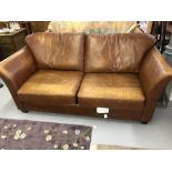 Furniture: Bespoke tan leather, three seater settee. Length 6ft. 6ins.