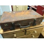 Travel: Early 20th cent. Leather suitcase with travel labels and lined interior, makers label