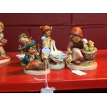 Hummel Figures: Girl with Geese, No 47/0, Barney and Hero, Sitting Boy with Bird on his Feet, No 63.