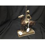 Metal Ware: Moulded metal sculpture of a polo player on horseback, 8ins. tall.