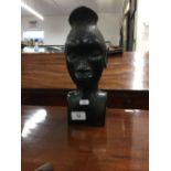 20th cent. Congolese Tribal Hardwood Head of a Young Woman: "On a bracket in one corner of our