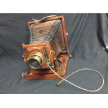 Cameras: Thornton Pickard ½ plate camera, mahogany & brass with stiffened card bellows.