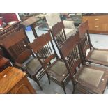 19th cent. Oak dining chairs, 1 carver and 4 chairs. Spindle back, and heavily decorated stylized