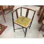 19th cent. Mahogany corner chair with floral inlays & green silk seat on turned supports.