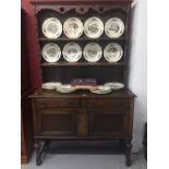 20th cent. Oak dresser, the base has two drawers and a two door cupboard with square on turned