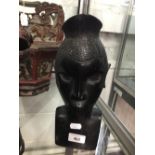 20th cent. Congolese Tribal Hardwood Head of a Young Woman: "On a bracket in one corner of our