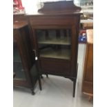 19th cent. Mahogany music cabinet with glazed door. The whole on square tapering supports. 21ins.