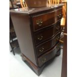 20th cent. Reproduction mahogany effect, serpentine 4 drawer bedside chest. 18½ins. x 28ins. x