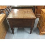 19th cent. Mahogany commode on turned supports.