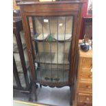 Edwardian mahogany and inlaid bow fronted display cabinet. Lead glazed coloured glass inserts,