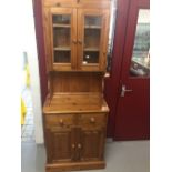 20th cent. Pine dresser. Glazed top with drawer and cupboard beneath. 28ins x 78ins. x 17½ins.